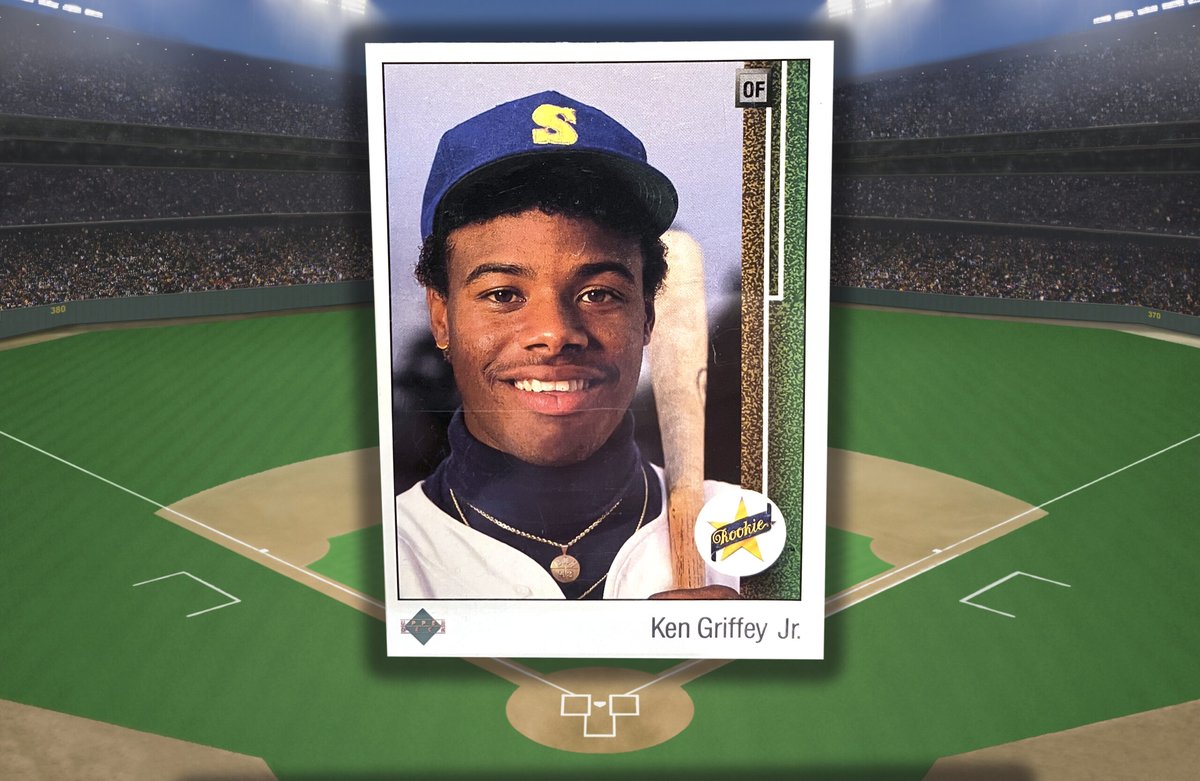 1989 Upper Deck Ken Griffey Jr Star Rookie #1 card photographed in front of a lit baseball stadium
